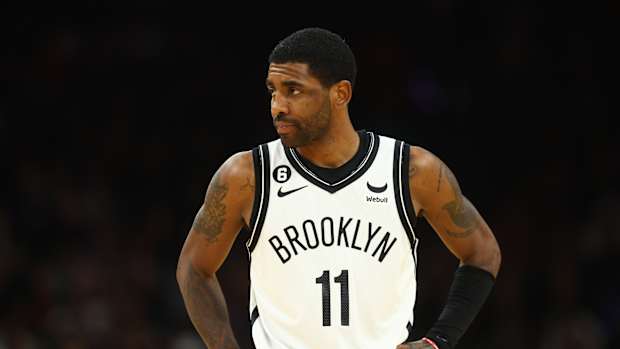 Kyrie Irving looks on during a game.